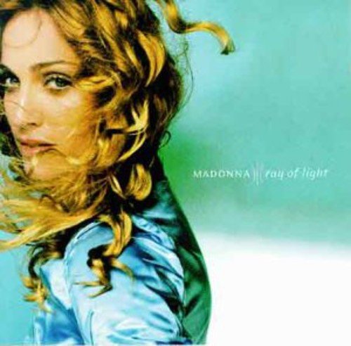 Madonna album cover: close-up of a woman with flowing blonde hair, blue shirt.