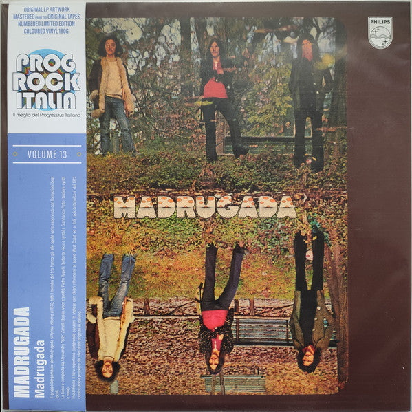 Album cover for "Madrugada" featuring a group in a park, legs in air.