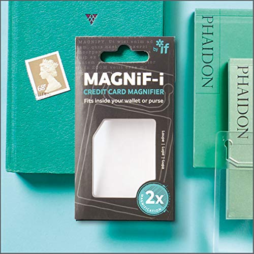 MAGNiF-i credit card magnifier in retail packaging on a light blue background with books.