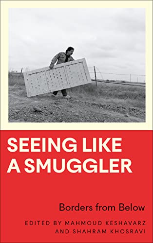 Book cover: person carrying a door near a border fence.