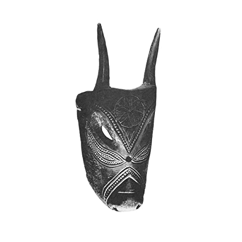 Black and white image of a carved wooden mask with horns.