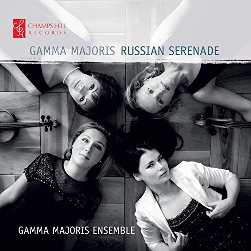 Black and white photo of four women with string instruments.