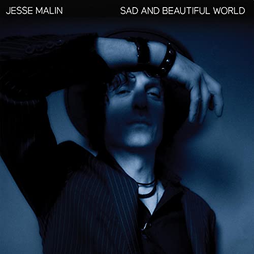 Jesse Malin album cover: a blue-toned portrait of a man with a hat.