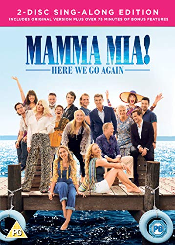 The cast of Mamma Mia Here We Go Again standing on a wooden pier.