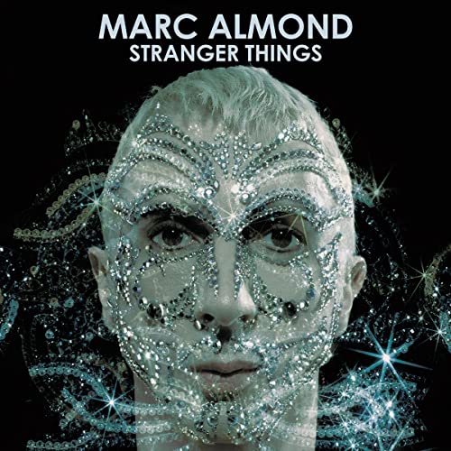 Marc Almond Stranger Things album cover showing his face covered in sparkling silver rhinestones.