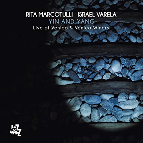 CD cover with dark blue stones and album title "Yin and Yang".