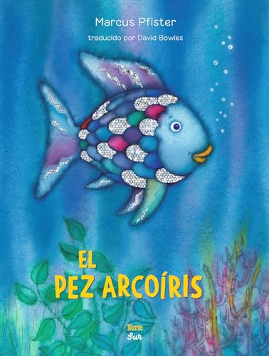 Blue fish with colorful, shimmering scales swimming in a blue ocean.