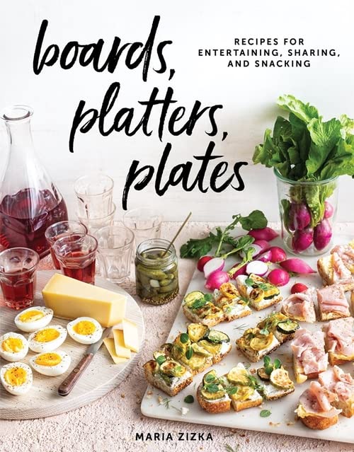 Cookbook cover featuring a styled wooden board with food and drinks.