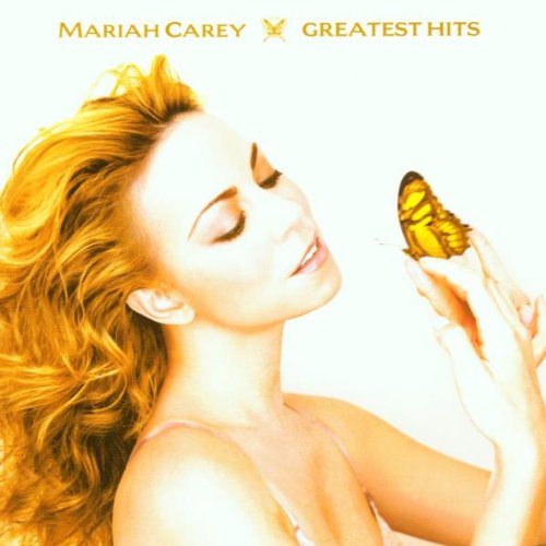 Mariah Carey with long blonde hair holding a butterfly on her finger, white background.