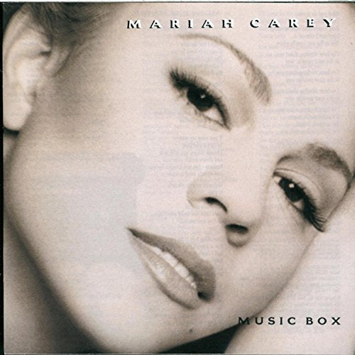 CloseClose-up sepia portrait of Mariah Carey for the Music Box album cover.