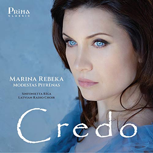 CD cover featuring a woman with blue eyes and dark hair against a blue background.