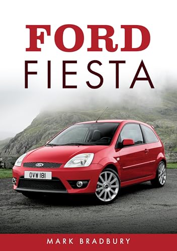 Red Ford Fiesta car on a road with mountains in background.