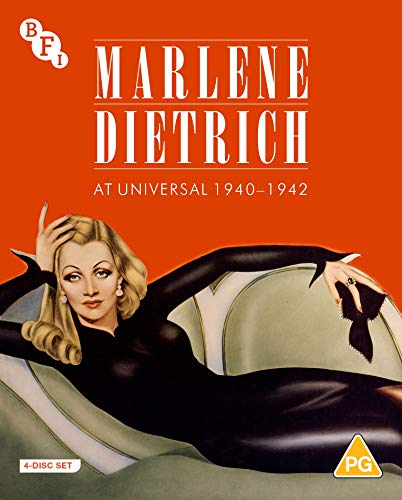 "Blonde woman in black dress on a couch, red background, white text, Blu-ray cover."