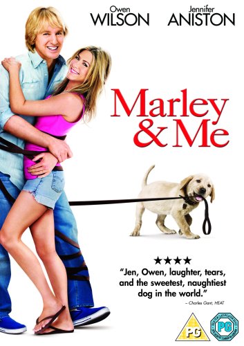 Couple embracing, with a golden Labrador puppy on a leash.