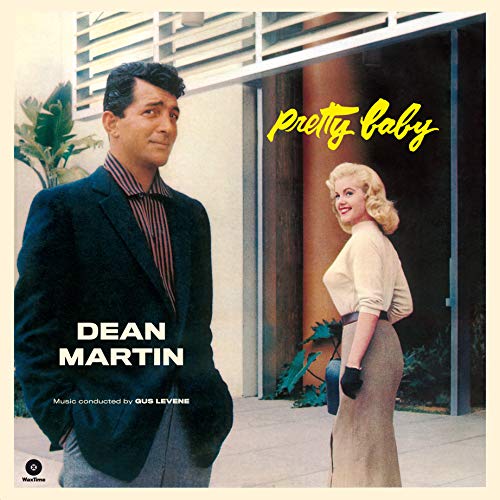 Dean Martin and a blonde woman standing outside on a vintage album cover.