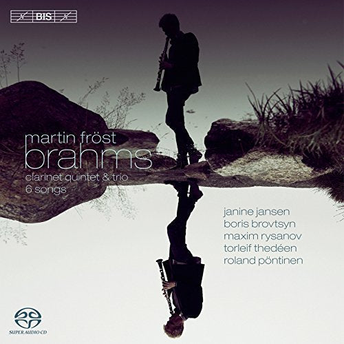"CD cover featuring a person standing on a rock, holding a clarinet, with reflection."
