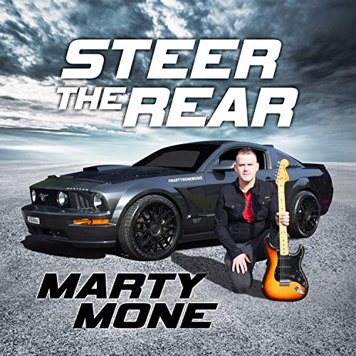 "Album cover with man kneeling beside a car, holding a guitar."