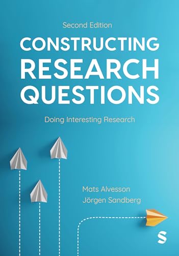 Blue book cover with white text and four white and orange paper airplanes.