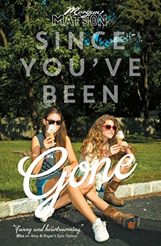 Two young women wearing sunglasses eat ice cream cones while sitting on a curb.