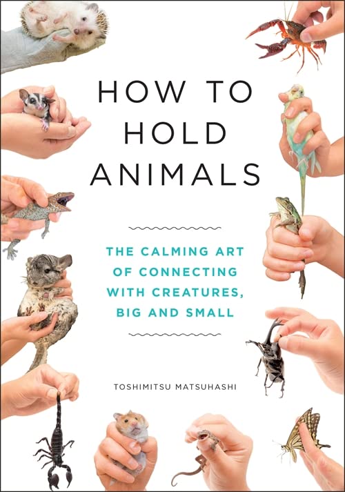 Book cover showing hands gently holding various small animals.