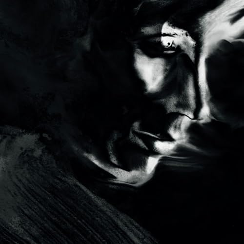 Black and white portrait of a face, partially obscured by shadow.