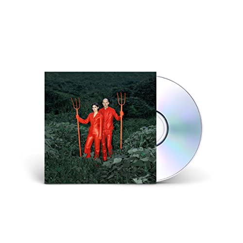 CD cover: couple in red jumpsuits holding pitchforks in foliage.