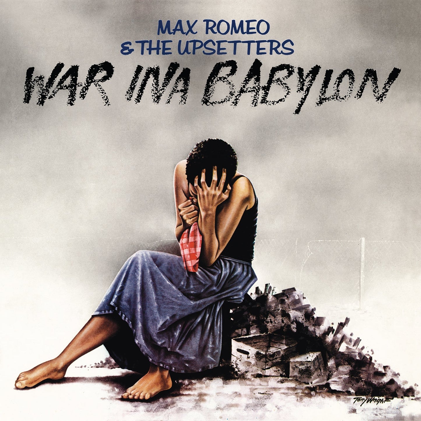 Album cover: seated person with head in hands, rubble background.