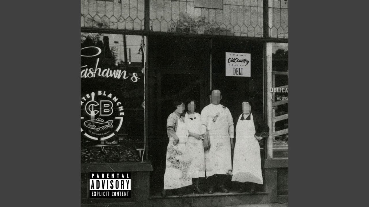 Black and white album cover for Fashawn's "Carte Blanche" with a deli storefront.