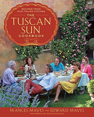Cookbook cover with authors and a group dining outdoors in Tuscany.