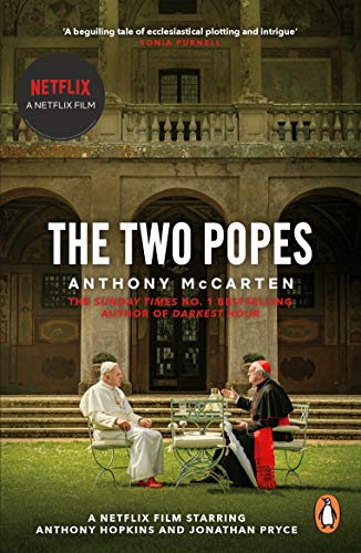 Book cover featuring two men in religious attire sitting at a table outdoors.