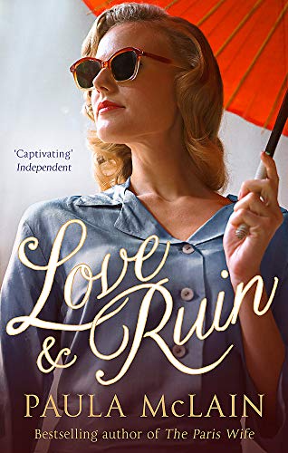 A woman with blonde hair and sunglasses holds a red parasol on a book cover.