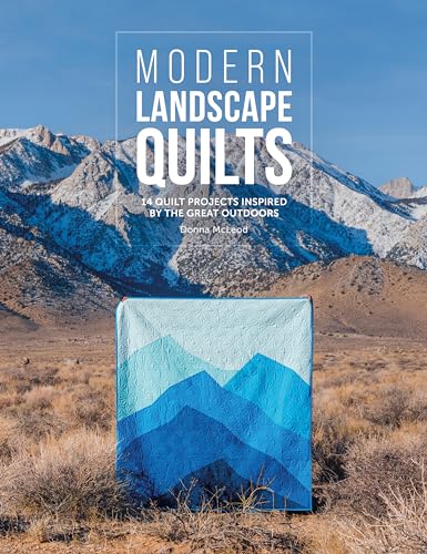 Book cover featuring a blue landscape quilt against a mountain backdrop.