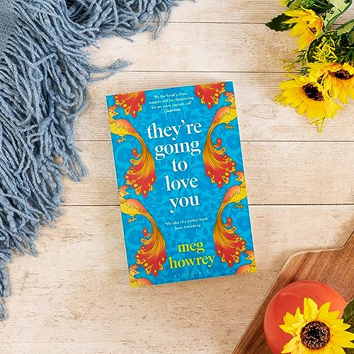 Book cover with colorful design, flowers, and a textured blue throw.