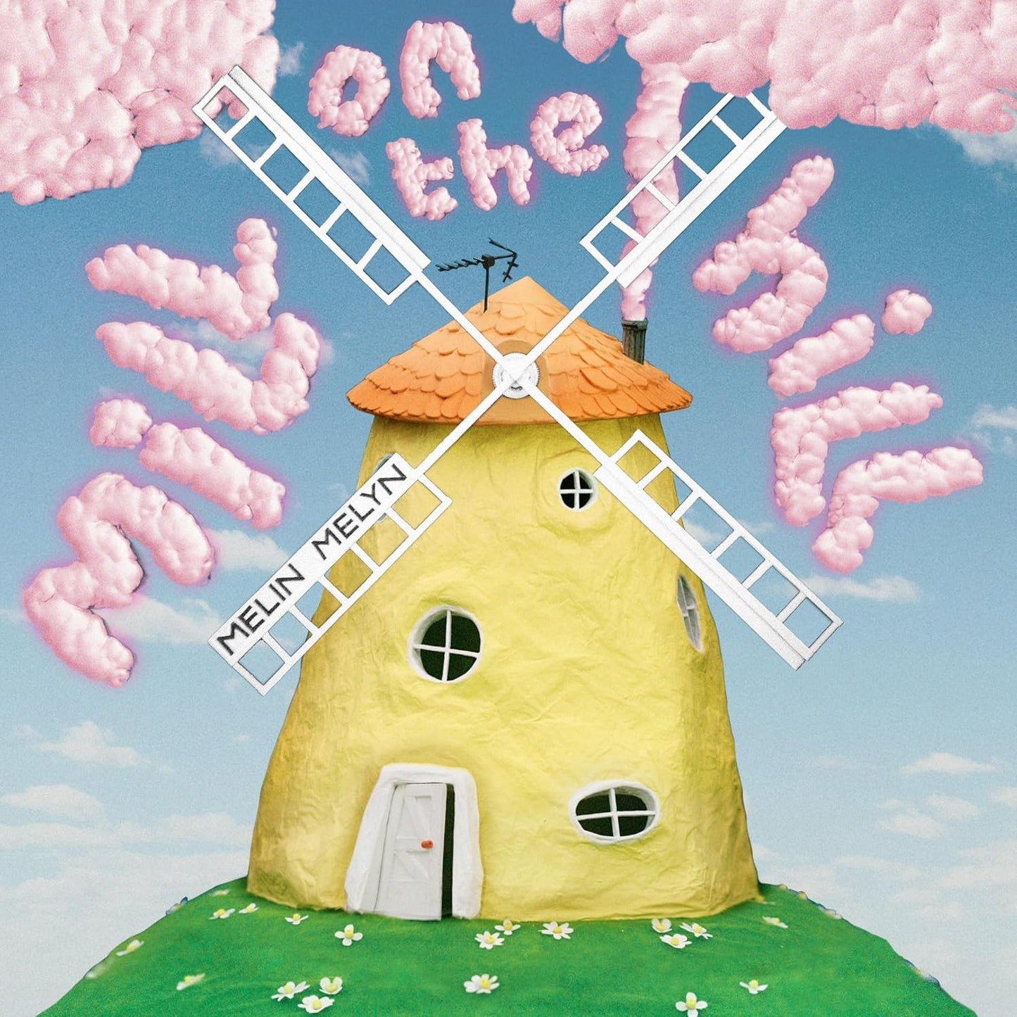 CD cover: yellow windmill with pink clouds on a blue sky.