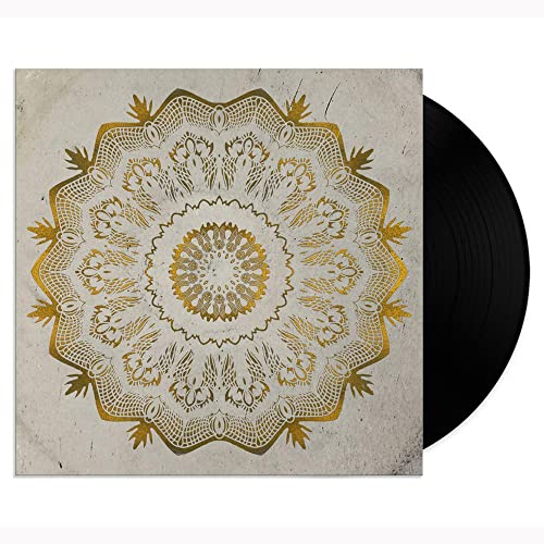 Vinyl record cover featuring a gold mandala pattern on a textured grey background.