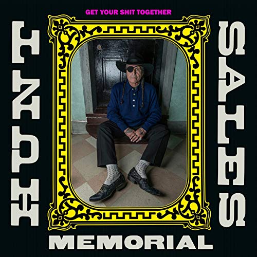 Vinyl album cover featuring a man sitting in a yellow ornate frame.