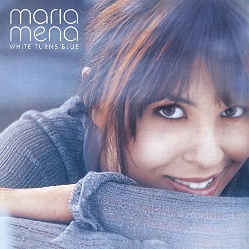 Close-up portrait of Maria Mena with dark hair and a gentle smile.