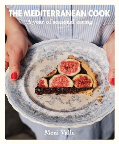 Cookbook cover featuring a slice of fig tart held in hands.