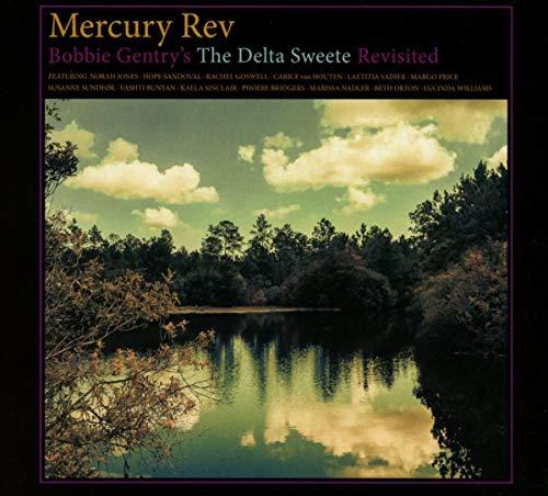 CD cover: a hazy, green landscape with a river reflecting the sky.