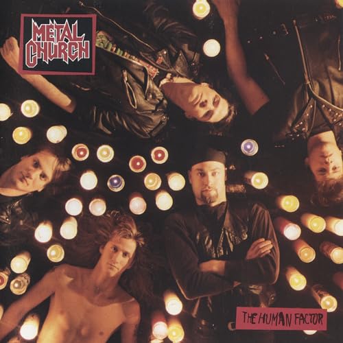 Album cover showing four band members surrounded by many lit candles in the dark.