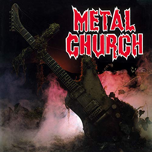 A guitar shaped like a cross covered in moss amidst pink and purple smoke.