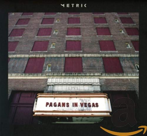 Metric's "Pagans In Vegas" CD cover with a building and marquee sign.