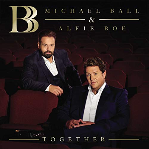 Michael Ball and Alfie Boe sitting in a dark theater for their album Together.