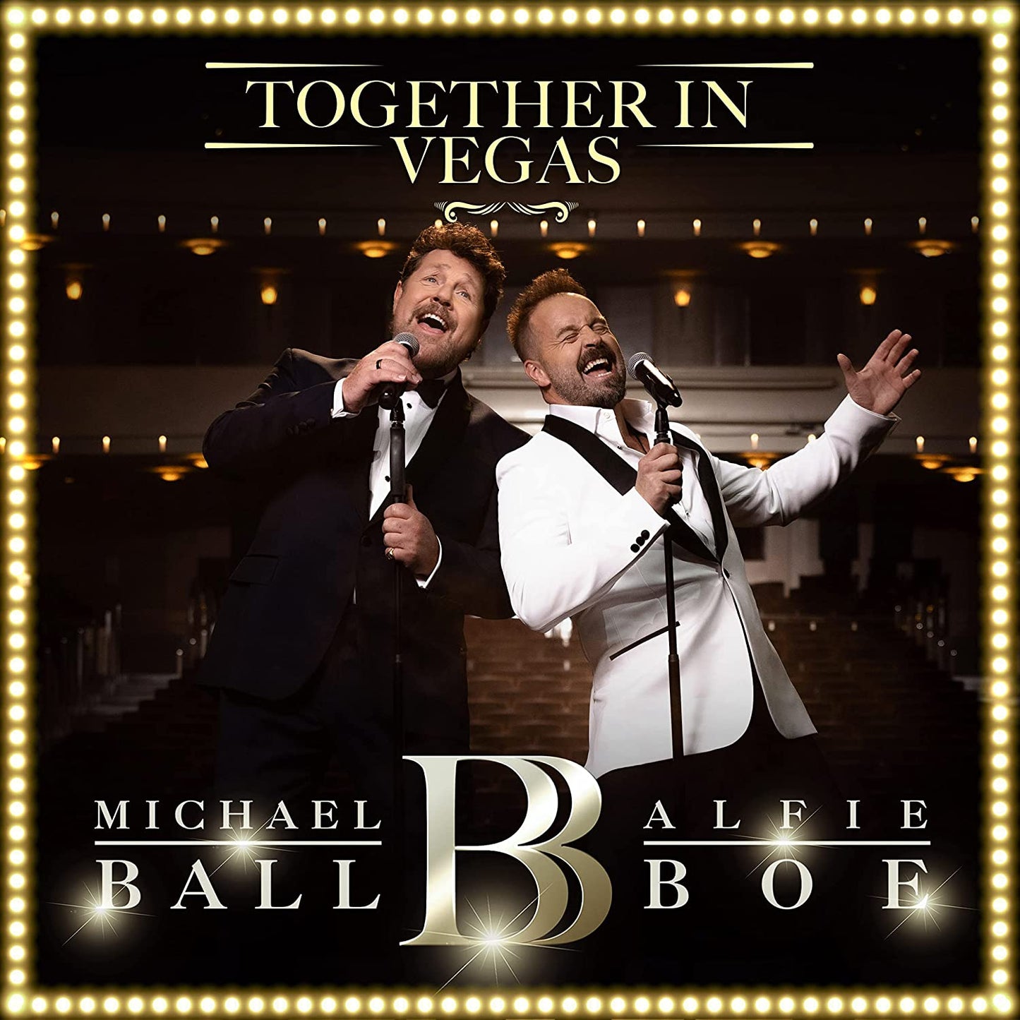 "Album cover featuring two men singing into microphones, surrounded by a light border."