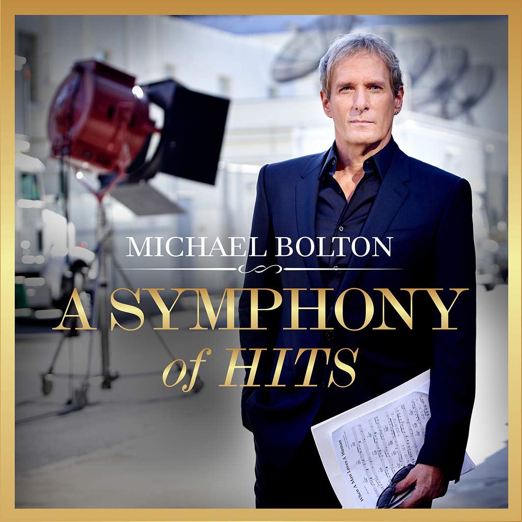 Michael Bolton album cover featuring the artist holding sheet music, with studio lights behind.