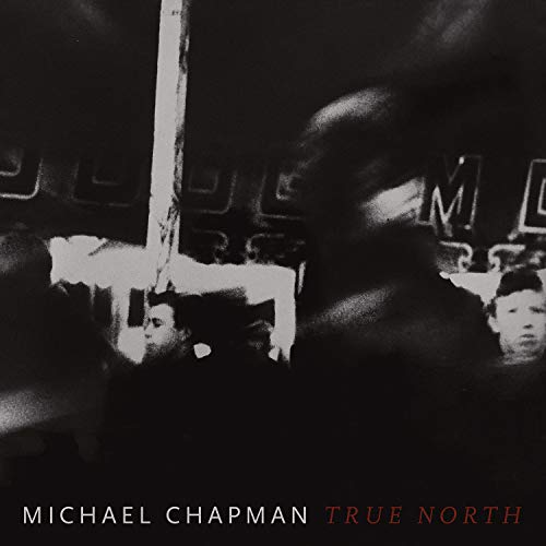 Black and white CD cover with a blurred street scene and text.