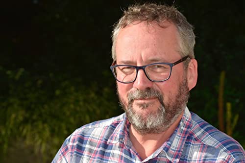 Close-up of a middle-aged man with glasses and a beard.