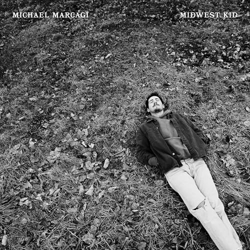 Black and white album cover: man lying in grass, text above.