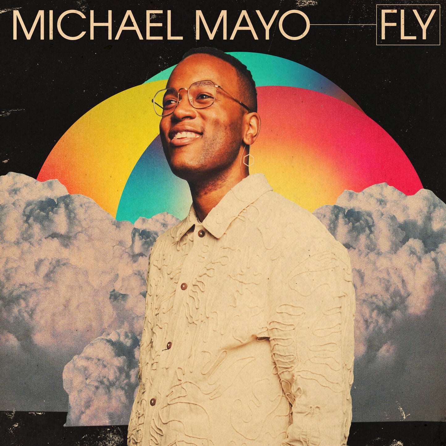 CD cover for Michael Mayo’s “Fly” featuring a portrait with rainbow arc.