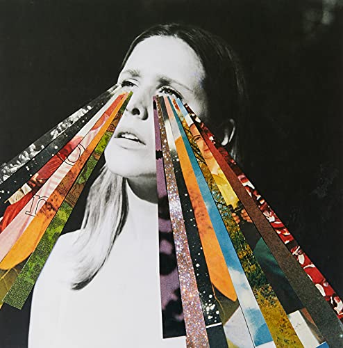 Black and white portrait with colorful, fragmented paper radiating from eyes.